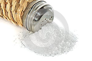 Scattered small group of salt and saltcellar on a photo