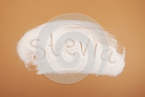 Scattered Stevia sweetener with inscription Stevia. Design element. Stevioside powder, natural sugar substitute. Food additive