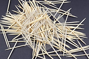 Scattered toothpicks on a black background