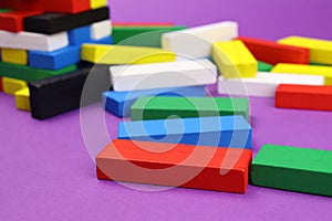 Scattered wooden colored blocks tower game