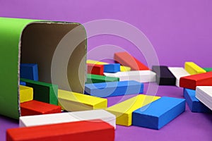 Scattered wooden colored blocks tower game