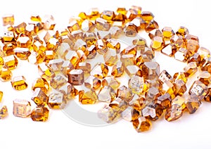 The scattered yellow synthetic diamonds in macro