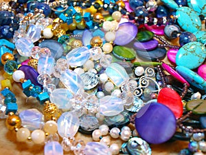 Scattering beads of semiprecious stones