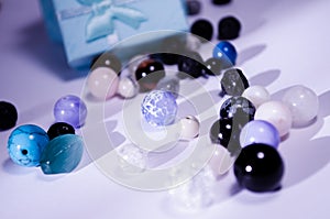 A scattering of natural stones. Beads made of natural stones.
