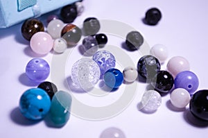 A scattering of natural stones. Beads made of natural stones.