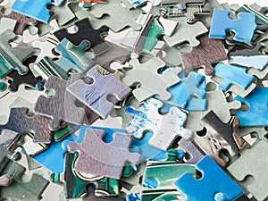 A scattering of puzzle pieces, a large mosaic, the development of attention and abilities in children