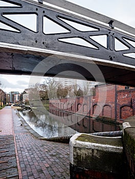 A scene along the canal in Birmingham City Centre. Photographed on a cold winter`s day with low grey clouds.