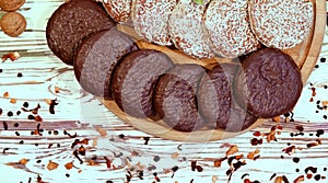 Scene with an assortment of baking, original Nuremberg gingerbread cookies on a wooden textured white background