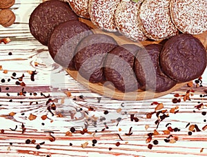 Scene with an assortment of baking, original Nuremberg gingerbread cookies on a wooden textured white background