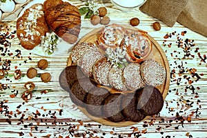 Scene with an assortment of pastries, original Nuremberg gingerbread cookies, rolls, croissants with ingredients. Top view