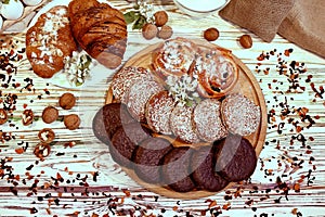 Scene with an assortment of pastries, original Nuremberg gingerbread cookies, rolls, croissants with ingredients. Top view