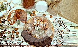 Scene with an assortment of pastries, original Nuremberg gingerbread cookies, rolls, croissants with ingredients. Top view