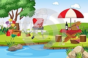 Scene with BBQ grill and food on the picnic table in the park