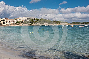 Scene on the beach with boats and houses