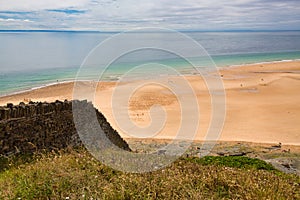 Scene of beach side with cloudy sky, saturated colors