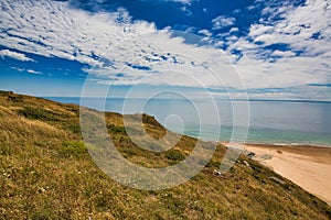 Scene of beach side with cloudy sky, saturated colors