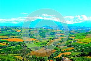 Scene in Carassai with fields sectoring the lands and impressive mountains