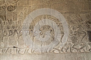 Scene of the Churning of the Milk Ocean carvings status on the wall of Angkor wat temple, world heritage, Siemreap, Cambodia