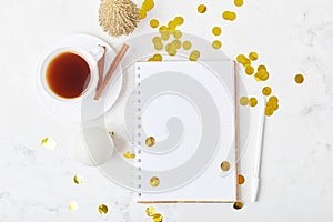 Scene with coffee cup, confetti, and notepad mock-up for a resolutions, for spirited new year