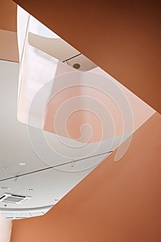 Low angle view of pink background interior of gallery