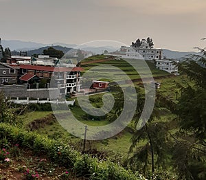 Scene of hill farming with hotels in ooty
