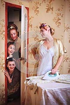 Scene with a housewife and friends. Humorous shot in a retro style