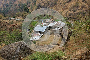 Suspension bridge and small hotels in Domen, Langtang National P