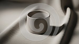 The scene is minimalist emphasizing the form and contrast between the cup