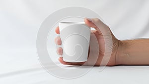 The scene is minimalistic emphasizing the simplicity and elegance of the cup