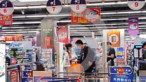 Shenzhen, China: People check out at the supermarket