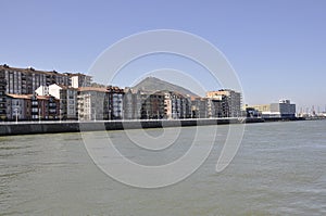 Scene with Residential building on the bank of Nervion river from Bilbao city in Basque Country of Spain