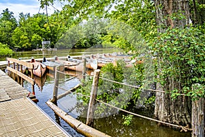 Scene of The RiviÃ¨re-des-Mille-ÃŽles Park with canoes at a quay