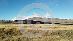 Scene of road trip in the car while moving forward on the beautiful scenic view of South Island New Zealand.