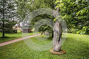 Scene of sculpture and boats at the Trois Berets parc in Saint Jean Port Joli