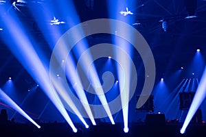 Scene, stage lights with colored spotlights and smoke, white and blue