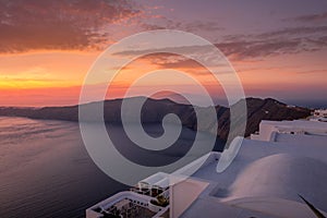 Scene of sunset overlooking the caldera and the sea in the village of Imerovigli on the island of Santorini