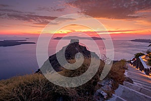 Scene of sunset overlooking the caldera and the sea in the village of Imerovigli on the island of Santorini