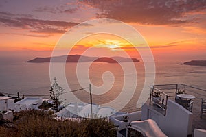 Scene of sunset overlooking the caldera and the sea in the village of Imerovigli on the island of Santorini