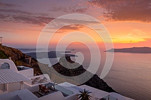 Scene of sunset overlooking the caldera and the sea in the village of Imerovigli on the island of Santorini