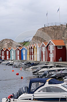 Scene of a tranquil harbor, featuring multiple vessels in Munkkyrkan in Smoegen, Sweden