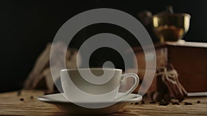 Scene twist with focusing on central modern coffee cup.From tradition to present