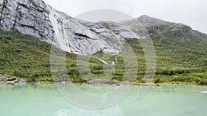 A scene of a very rainy day in the Briksdal Glacier Valley, Norway