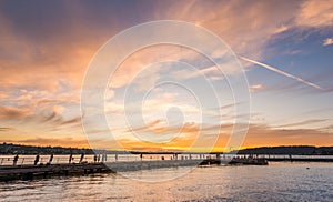 Scene of walk way on the lake when sunset in Gene Coulon Memorial Beach Park,Renton,Washington,usa.