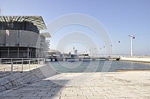 Scene with waterfront Oceanarium building from Parque das Nacoes or Park of the Nations area in Lisbon