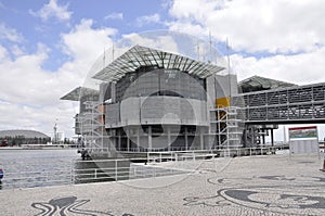 Scene with waterfront Oceanarium Modern building from Parque das Nacoes or Park of the Nations area in Lisbon