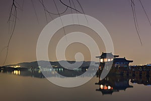 Scenerey reflected in West lake at night, Hangzhou, China