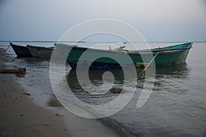 Scenery of boats standing at the ocean shore in Brazil