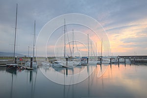 Scenery of fishing boats and yachts parking in marina under stormy sky in I-lan, Taiwan