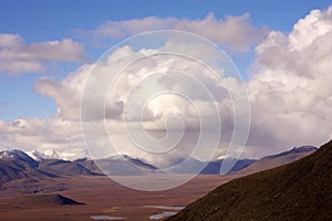 Scenery of hills under the cloudy sky in the Gates of the Arctic National Park