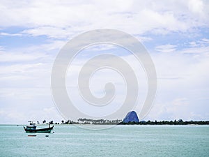 The scenery of the island and the calm sea.